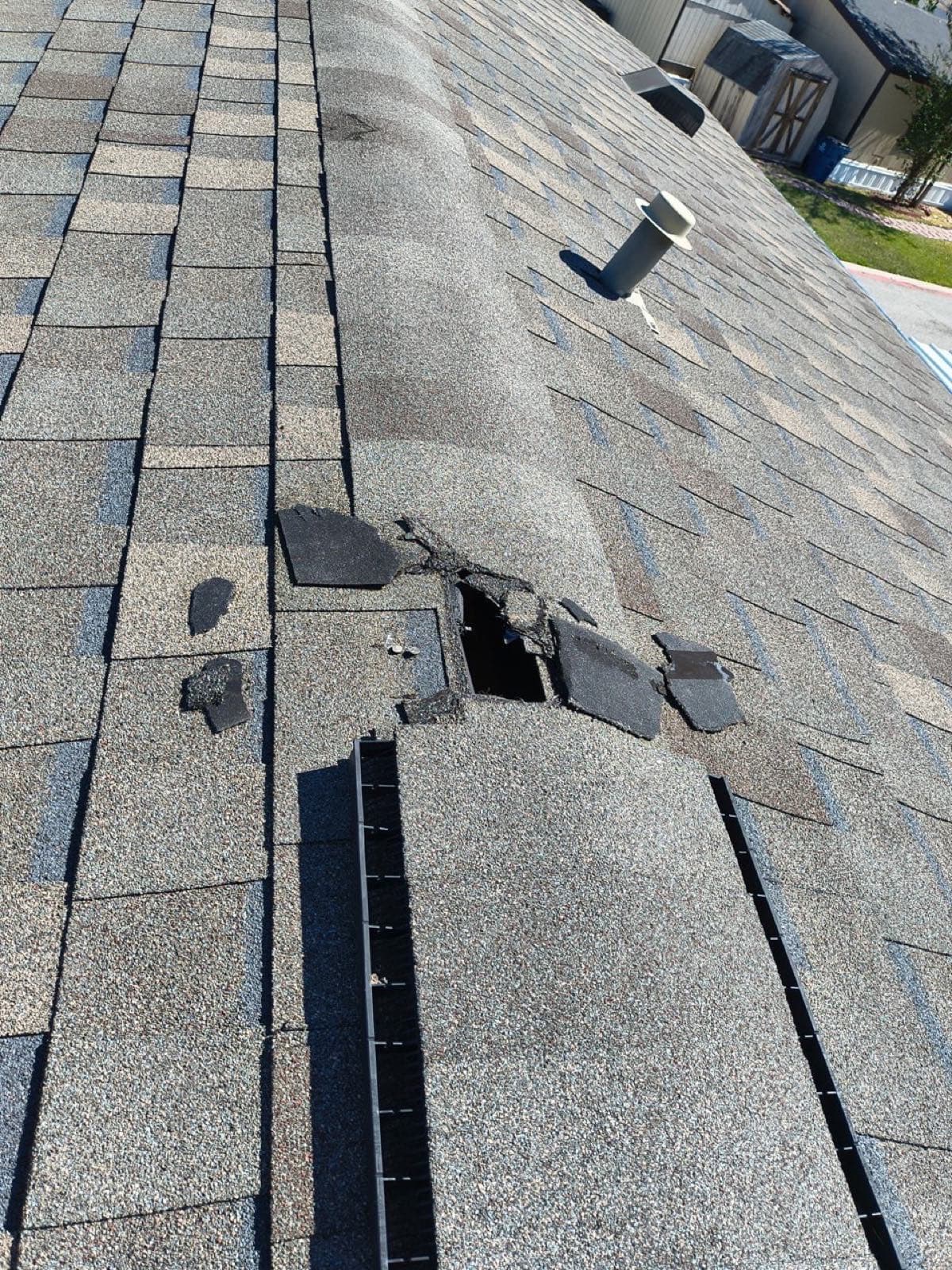 Missing ridge shingles after a Fort Worth storm