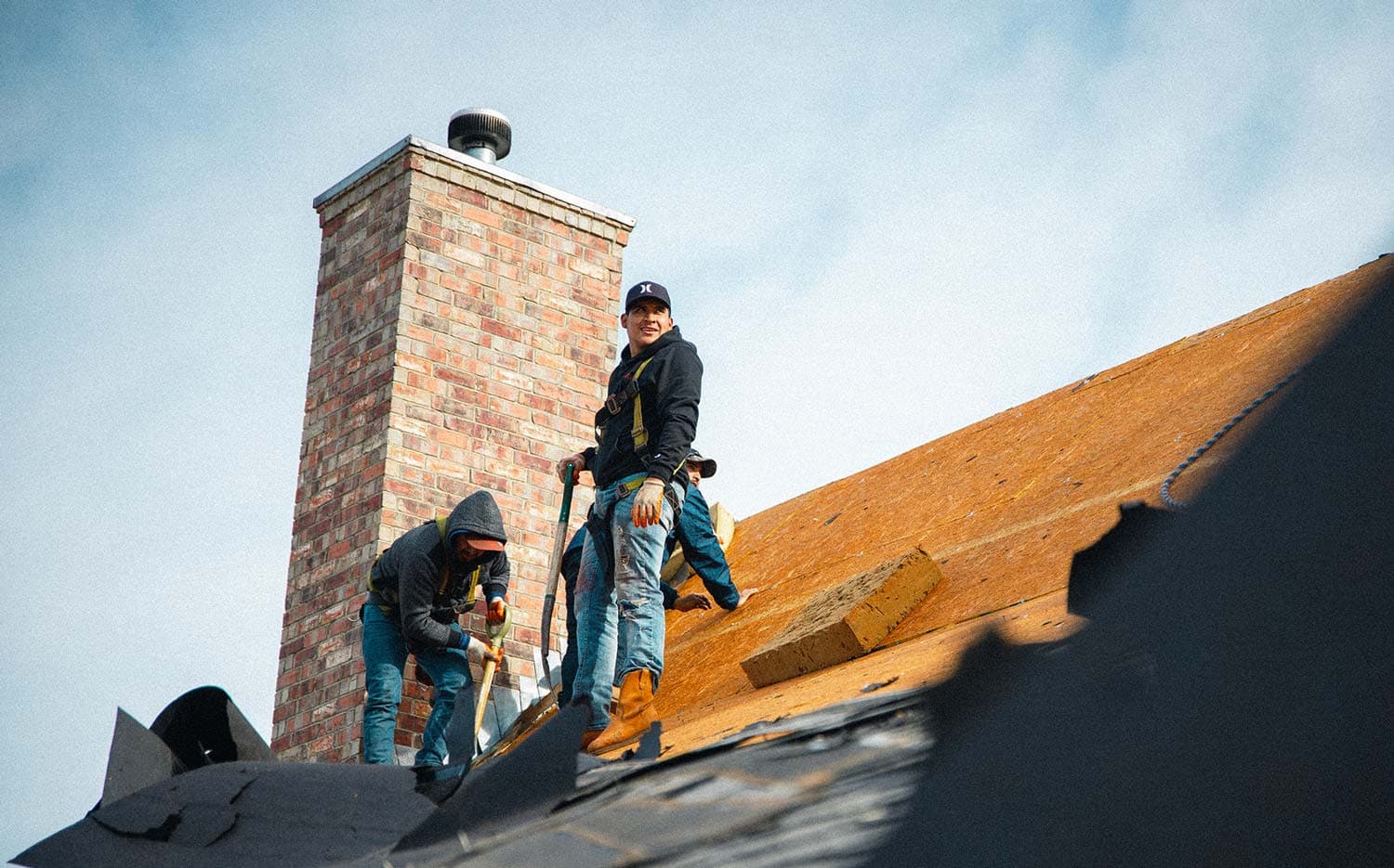 Roof tear-off exposing the deck for inspection and preparation