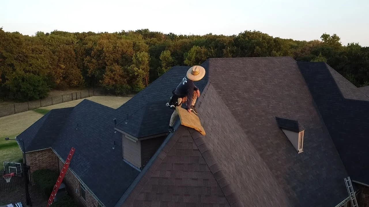 Fort Worth roofing contractor inspecting a residential shingle roof